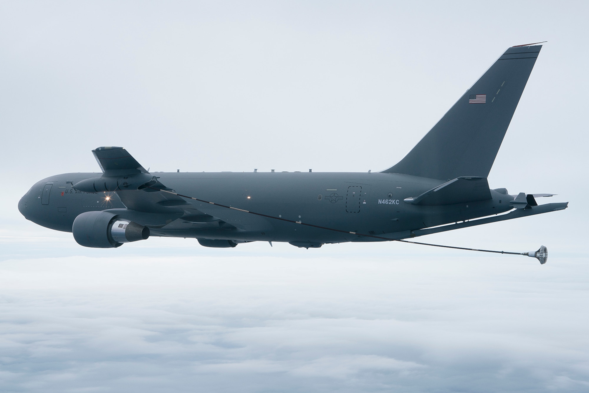 The KC-46A Pegasus deploys the drogue from the wing aerial refueling pods located on the wing tips Oct. 8, 2015. The drogue systems are used to refuel helicopters along with Navy and Marine Corps aircraft. (Boeing photo/John D. Parker)