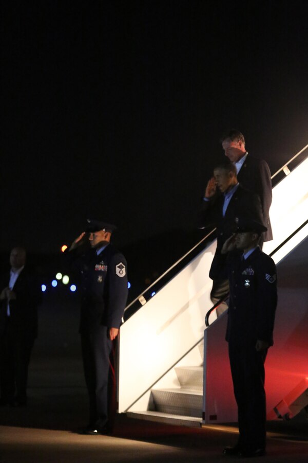 President Barack Obama returns the salutes of his greeting party aboard Marine Corps Air Station Miramar, Calif., Oct. 10. President Barack Obama debarked Air Force One, the presidential plane, and greeted leadership with the 3rd Marine Aircraft Wing and MCAS Miramar.