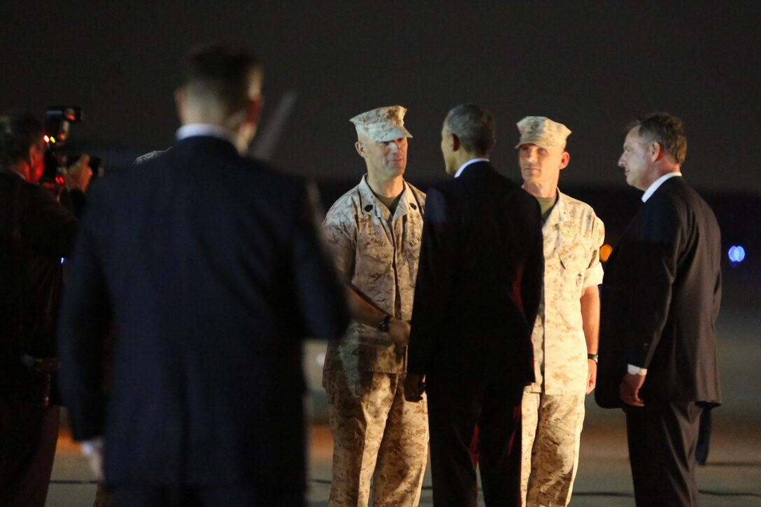 President Barack Obama greets Sgt. Maj. Patrick Kimble, sergeant major of the 3rd Marine Aircraft Wing, aboard Marine Corps Air Station Miramar, Calif., Oct. 10. The president paid a quick visit to the air station after debarking Air Force One, the presidential jet.
