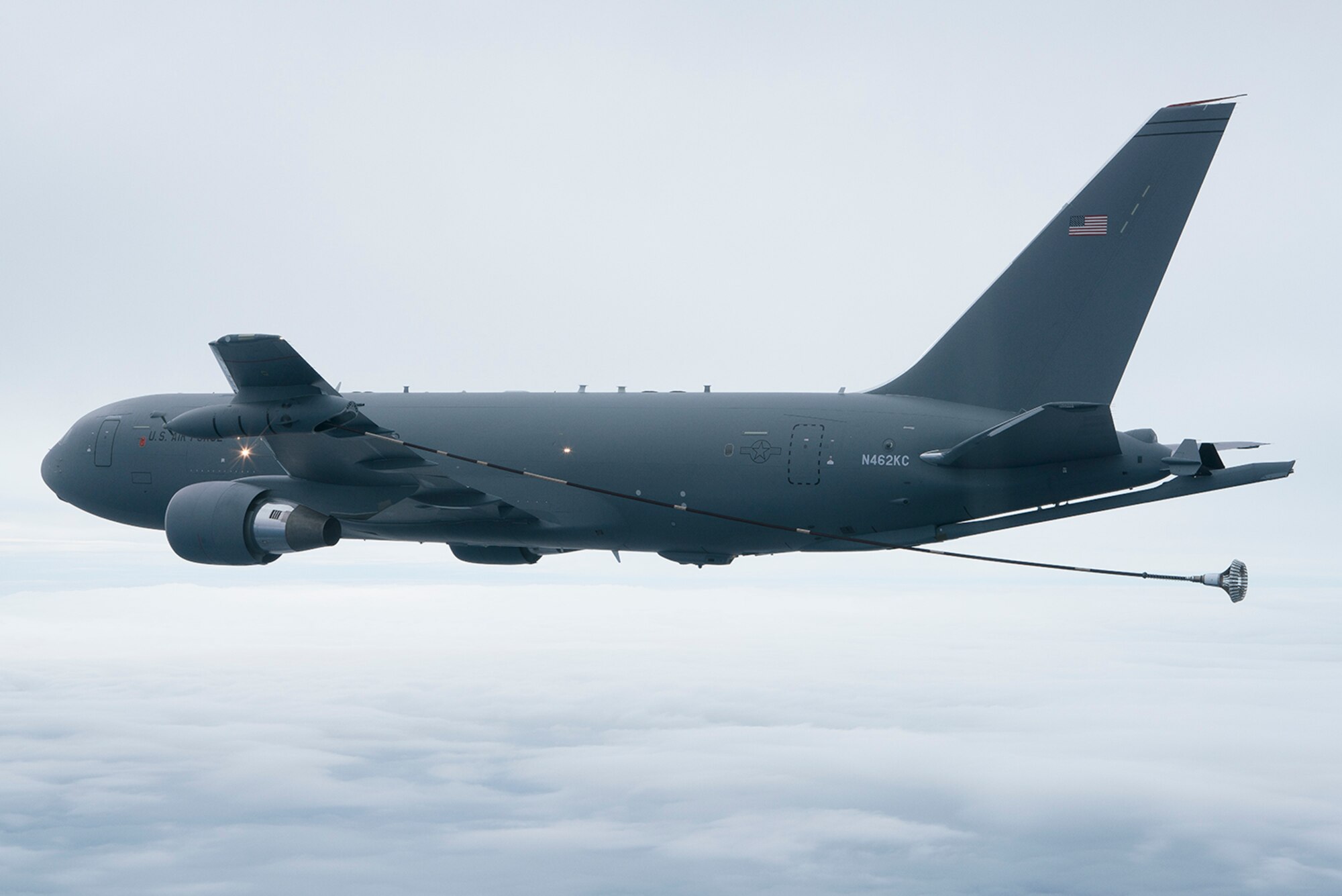 The KC-46A Pegasus tanker deploys the drogue from the Wing Aerial Refueling Pods located on the wing tips Oct. 8.  The drogue systems are used to refuel helicopters along with Navy and Marine Corps aircraft.  (Boeing photo by John D. Parker)  
