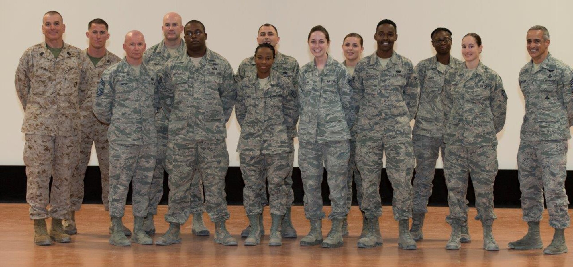 Sgt. Maj. Bryan Battaglia, Senior Enlisted Advisor to the Chairman of the Joint Chiefs of Staff, joins 10 service members from across Al Udeid Air Base, Qatar for a group photo after he recognized them for excellent performance during an Enlisted All-Call at the Coalition Compound theater Oct. 8, 2015. During the All-Call, Battaglia covered numerous topics including professional development, joint missions and the Department of Defense’s bi-annual award review. (U.S. Air Force Photo/Tech. Sgt. James Hodgman)
