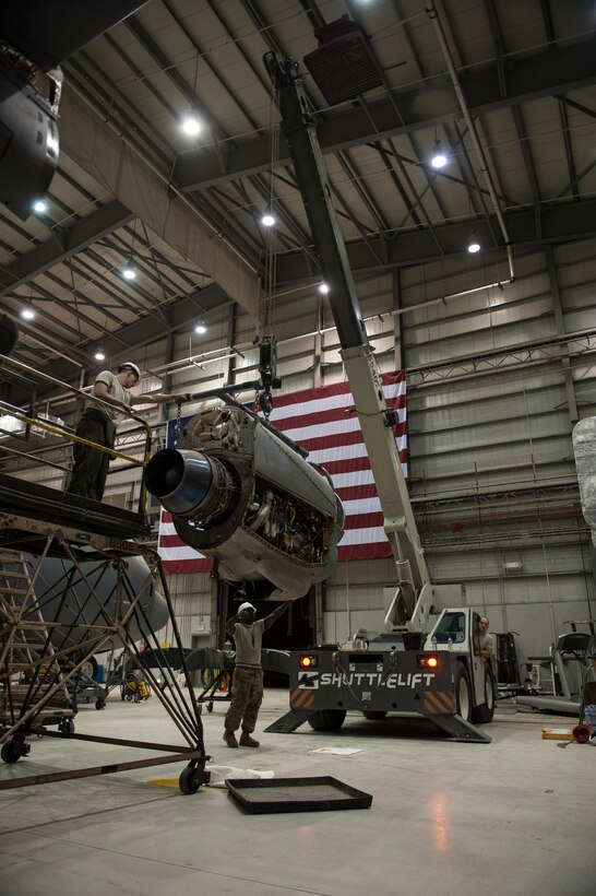 U.S. Airmen assigned to the 455th Expeditionary Maintenance Squadron change an engine out on a C-130J Super Hercules aircraft at Bagram Airfield, Afghanistan, Oct. 1, 2015.  The C-130’s short takeoff and landing capability makes it an optimum fit for Afghanistan’s rugged terrain.  (U.S. Air Force photo by Tech. Sgt. Joseph Swafford/Released)