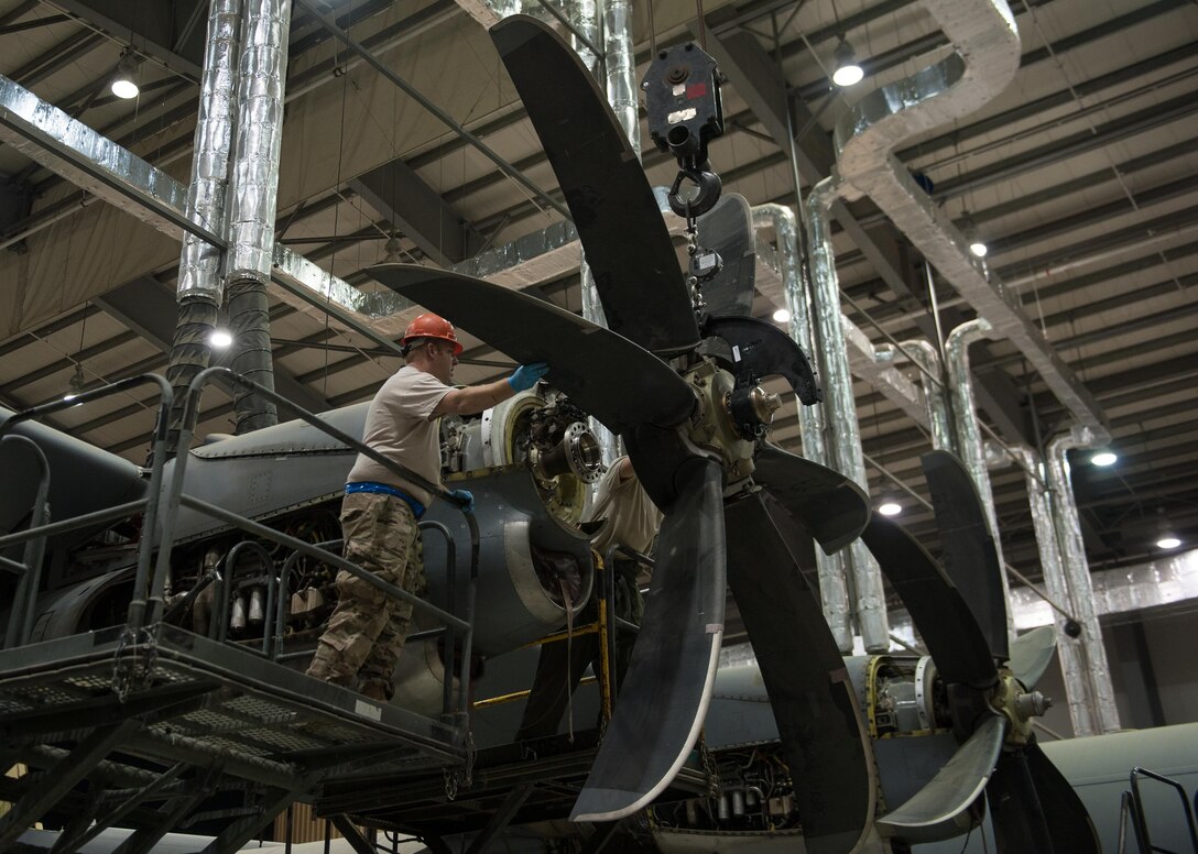 U.S. Airmen assigned to the 455th Expeditionary Maintenance Squadron change an engine out on a C-130J Super Hercules aircraft at Bagram Airfield, Afghanistan, Oct. 1, 2015.  The C-130’s short takeoff and landing capability makes it an optimum fit for Afghanistan’s rugged terrain.  (U.S. Air Force photo by Tech. Sgt. Joseph Swafford/Released)
