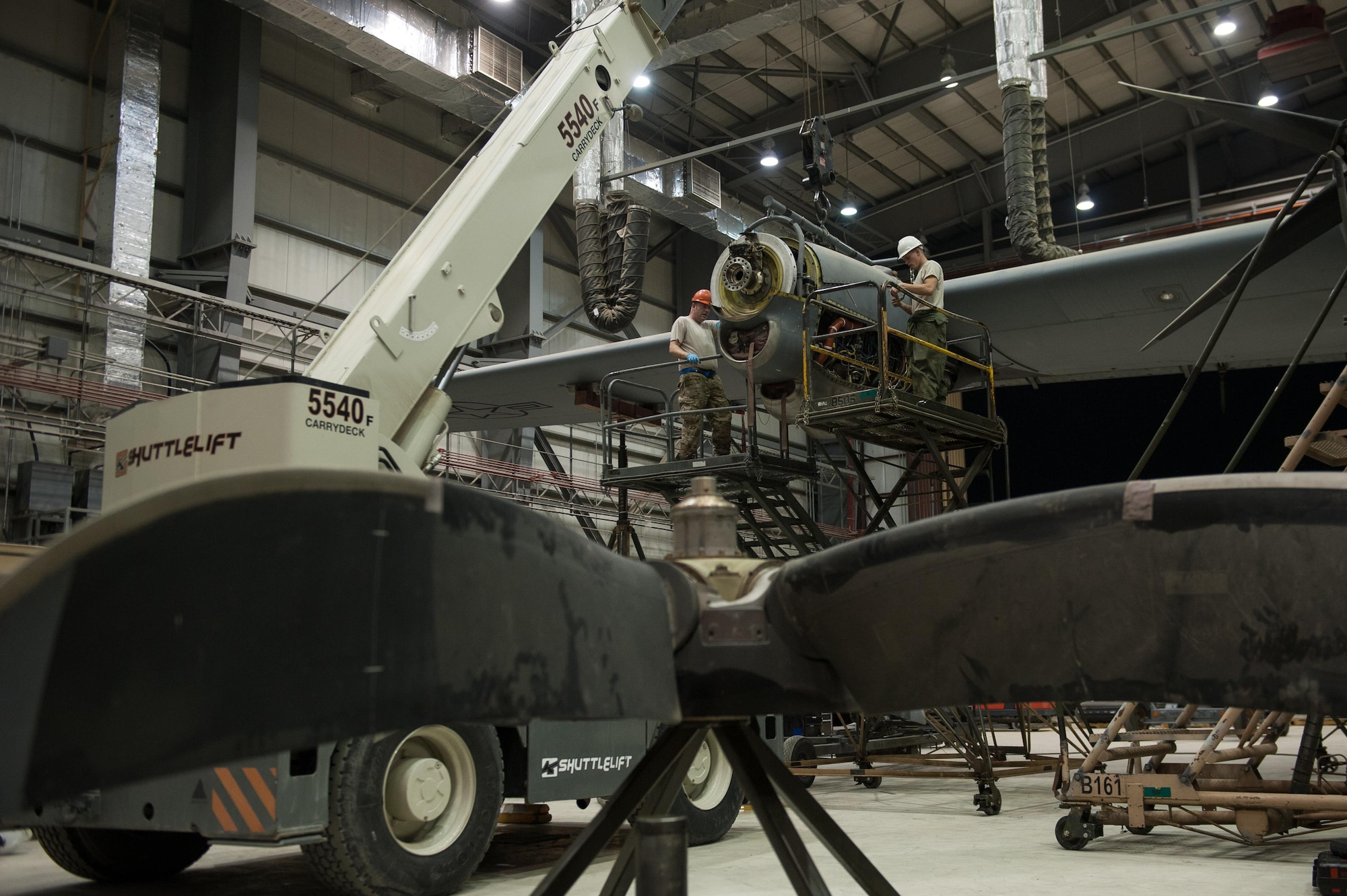 U.S. Airmen assigned to the 455th Expeditionary Maintenance Squadron change an engine out on a C-130J Super Hercules aircraft at Bagram Airfield, Afghanistan, Oct. 1, 2015.  The C-130’s short takeoff and landing capability makes it an optimum fit for Afghanistan’s rugged terrain.  (U.S. Air Force photo by Tech. Sgt. Joseph Swafford/Released)
