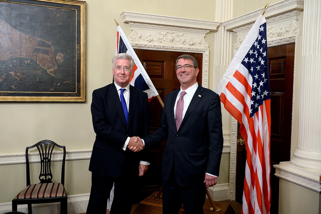 U.S. Defense Secretary Ash Carter poses for a photo with British Secretary of State for Defense Michael Fallon in London, Oct. 9, 2015. Carter is on a five-day trip to Europe to attend the NATO Defense Ministerial Conference in Brussels and to meet with counterparts in Spain, Italy, and the United Kingdom. DoD photo by U.S. Army Sgt. 1st Class Clydell Kinchen
