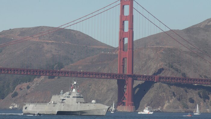 A U.S. Navy ship passes under the Golden Gate Bridge during the parade of ships event as part of San Francisco Fleet Week 2015, Oct. 9, 2015. The parade of ships is a traditional part of Fleet Week in which service members and San Francisco natives pay respects to the ships who pass through the harbor. SFFW 15’ is a week-long event that blends a unique training and education program, bringing together key civilian emergency responders and Naval crisis-response forces to exchange best practices on humanitarian assistance disaster relief with particular emphasis on defense support to civil authorities.