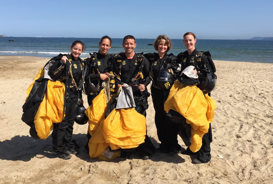 The U.S. Armed Forces Parachuting Team featuring the Army Golden Knights Parachuting Team get ready for their formation dive. The U.S. women won gold while setting the CISM World Record in Formation Sky Diving. From left to right: SFC Jennifer Davis; SFC Dannielle Woosely; SFC Scott Janis (Videographer); SFC Laura Davis; SFC Angela Nichols; 