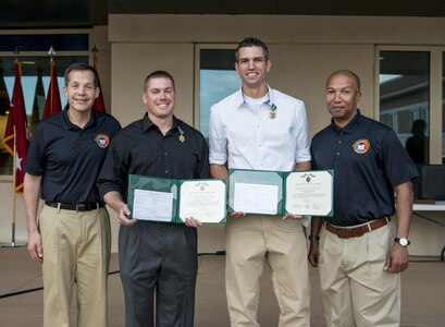 Staff Sgt. Andrew Fink (first place winner, noncommissioned officer category), 409th Area Support Medical Company, a native of Cook, Minn., and Spc. Bryce Parker (first place winner, Soldier category), from Marana, Ariz., with the 492nd Civil Affairs Battalion, stand with Lt. Gen. Jeffrey Talley (left), chief of U.S. Army Reserve, and Command Sgt. Maj. Luther Thomas, command sergeant major of the U.S. Army Reserve, at the awards ceremony for the 2015 U.S. Army Reserve Best Warrior Competition at Fort Bragg, N.C., May 7. Both Soldiers received the Army Commendation Medal for their achievement. This year's top winners will represent the Army Reserve in the Department of the Army Best Warrior Competition at Fort Lee, Va. (U.S. Army photo by Sgt. 1st Class Michel Sauret)