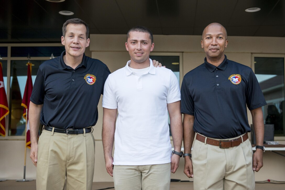 Spc. Adam L. Job, a medical laboratory specialist with the 4225th U.S. Army Hospital, Fort Harrison, Mont., is the runner up in the Soldier category for the 2015 U.S. Army Reserve Best Warrior Competition. Job stands with Lt. Gen. Jeffrey Talley (left), chief of U.S. Army Reserve, and Command Sgt. Maj. Luther Thomas, command sergeant major of the U.S. Army Reserve, at the awards ceremony at Fort Bragg, N.C., May 7. This year's top noncommissioned officer and junior enlisted Soldier will represent the Army Reserve in the Department of the Army Best Warrior Competition at Fort Lee, Va. (U.S. Army photo by Sgt. 1st Class Michel Sauret)