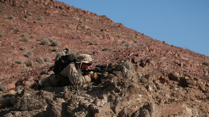 ARTA BEACH, Djibouti (Sept. 29, 2015) U.S. Marine 1st Lt. Michael Hosteny provides security for his squad during a patrolling exercise during a desert survival course with the French 5th Overseas Combined Arms Regiment (RIAOM). Hosteny is the executive officer of Delta Company, 1st Light Armored Reconnaissance Detachment, Battalion Landing Team 3rd Battalion, 1st Marine Regiment, 15th Marine Expeditionary Unit. Elements of the 15th MEU are training with the 5th RIAOM in Djibouti in order to improve interoperability between the MEU and the French military. (U.S. Marine Corps photo by Sgt. Steve H. Lopez/Released)