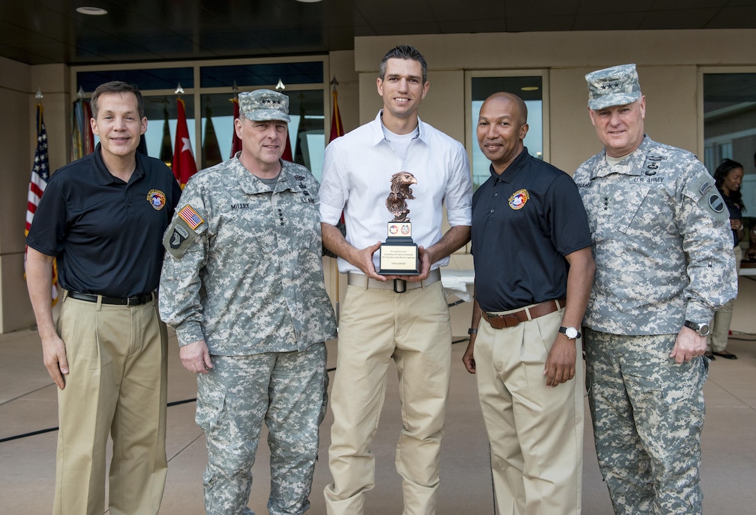 Spc. Bryce Parker, from Marana, Ariz., with the 492nd Civil Affairs Battalion, is the winner of the Soldier category for the 2015 U.S. Army Reserve Best Warrior Competition. Parker stands with Lt. Gen. Jeffrey Talley, chief of U.S. Army Reserve, Gen. Mark A Milley, commanding general of U.S. Army Forces Command, Command Sgt. Maj. Luther Thomas, command sergeant major of the U.S. Army Reserve, and Lt. Gen. Patrick J. Donahue, deputy commanding general of U.S. Army Forces Command, at the awards ceremony at Fort Bragg, N.C., May 7. This year's top noncommissioned officer and junior enlisted Soldier will represent the Army Reserve in the Department of the Army Best Warrior Competition at Fort Lee, Va. (U.S. Army photo by Sgt. 1st Class Michel Sauret)