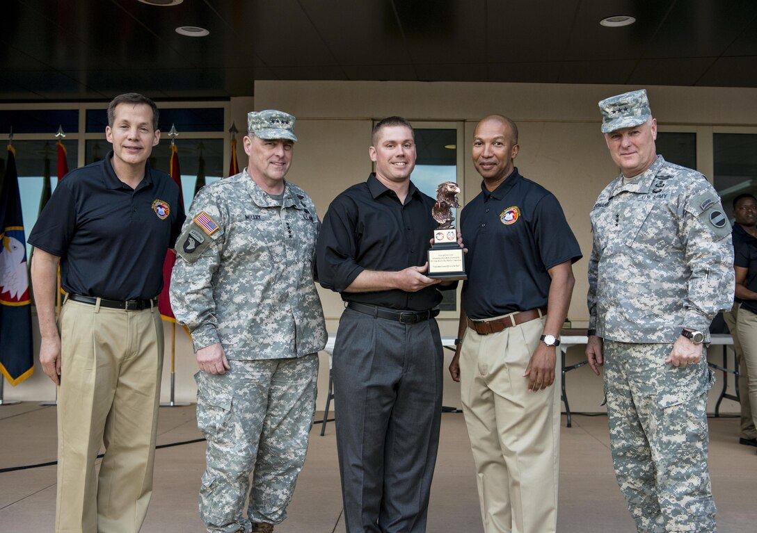 Staff Sgt. Andrew Fink, 409th Area Support Medical Company, a native of Cook, Minn., is the winner of the noncommissioned officer category in the 2015 U.S. Army Reserve Best Warrior Competition. He stands with Lt. Gen. Jeffrey Talley, chief of U.S. Army Reserve, Gen. Mark A Milley, commanding general of U.S. Army Forces Command, Command Sgt. Maj. Luther Thomas, command sergeant major of the U.S. Army Reserve, and Lt. Gen. Patrick J. Donahue, deputy commanding general of U.S. Army Forces Command, at the awards ceremony at Fort Bragg, N.C., May 7. This year's top noncommissioned officer and junior enlisted Soldier will represent the Army Reserve in the Department of the Army Best Warrior Competition at Fort Lee, Va. (U.S. Army photo by Sgt. 1st Class Michel Sauret)