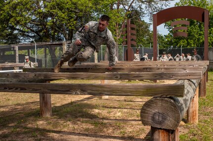 Staff Sgt. Chad Schoenfelder, representing the 108th Training Command (Initial Entry Training), completes an obstacle at the "Little Nasty Nick" obstacle course at the 2015 U.S. Army Reserve Best Warrior Competition at Fort Bragg, N.C., May 6. This year's Army Reserve Best Warrior Competition will determine the top noncommissioned officer and junior enlisted Soldier who will represent the Army Reserve in the Department of the Army Best Warrior competition in October at Fort Lee, Va. (U.S. Army photo by Timothy L. Hale/Released)