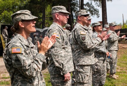 Competition cadre cheer on competitors at the "Little Nasty Nick" obstacle course at the 2015 U.S. Army Reserve Best Warrior Competition at Fort Bragg, N.C., May 6. This year's Army Reserve Best Warrior Competition will determine the top noncommissioned officer and junior enlisted Soldier who will represent the Army Reserve in the Department of the Army Best Warrior competition in October at Fort Lee, Va. (U.S. Army photo by Timothy L. Hale/Released)