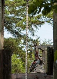 Sgt. Josue Lebron, representing the 1st Mission Support Command in Puerto Rico, completes an obstacle at the "Little Nasty Nick" obstacle course at the 2015 U.S. Army Reserve Best Warrior Competition at Fort Bragg, N.C., May 6. This year's Army Reserve Best Warrior Competition will determine the top noncommissioned officer and junior enlisted Soldier who will represent the Army Reserve in the Department of the Army Best Warrior competition in October at Fort Lee, Va. (U.S. Army photo by Timothy L. Hale/Released)