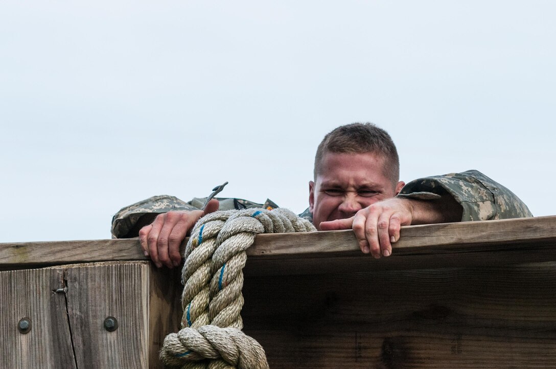Staff Sgt. Andrew Fink, representing the 807th Medical Command (Deployment Support), completes an obstacle at the "Little Nasty Nick" obstacle course at the 2015 U.S. Army Reserve Best Warrior Competition at Fort Bragg, N.C., May 6. This year's Army Reserve Best Warrior Competition will determine the top noncommissioned officer and junior enlisted Soldier who will represent the Army Reserve in the Dept. of the Army Best Warrior competition in Oct. at Fort Lee, Va. (U.S. Army photo by Timothy L. Hale/Released)