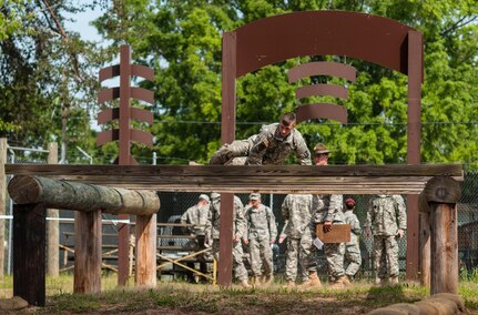 Spc. Ian Hagan, representing the 416th Theater Engineer Command, completes an obstacle at the "Little Nasty Nick" obstacle course at the 2015 U.S. Army Reserve Best Warrior Competition at Fort Bragg, N.C., May 6. This year's Army Reserve Best Warrior Competition will determine the top noncommissioned officer and junior enlisted Soldier who will represent the Army Reserve in the Dept. of the Army Best Warrior competition in Oct. at Fort Lee, Va. (U.S. Army photo by Timothy L. Hale/Released)