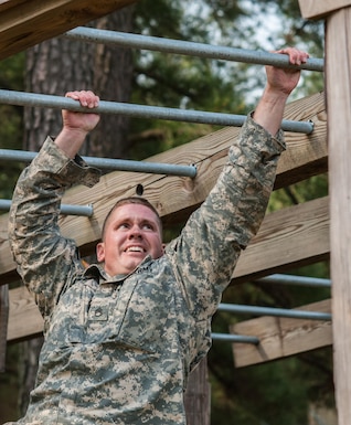 Staff Sgt. Andrew Fink, representing the 807th Medical Command (Deployment Support), completes an obstacle at the "Little Nasty Nick" obstacle course at the 2015 U.S. Army Reserve Best Warrior Competition at Fort Bragg, N.C., May 6. This year's Army Reserve Best Warrior Competition will determine the top noncommissioned officer and junior enlisted Soldier who will represent the Army Reserve in the Department of the Army Best Warrior competition in October at Fort Lee, Va. (U.S. Army photo by Timothy L. Hale/Released)