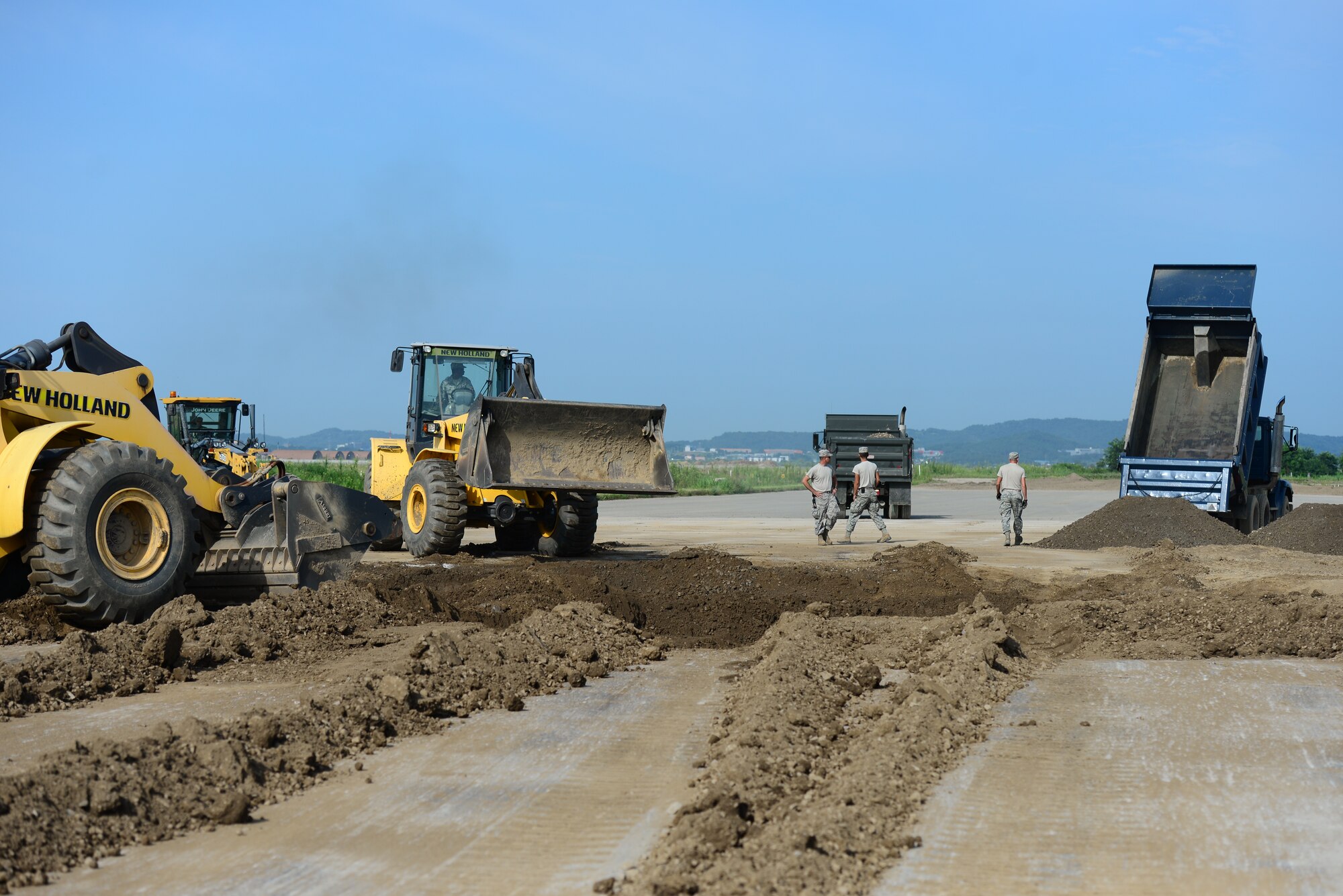 Airmen from the 51st Civil Engineer Squadron pavement and constructions equipment shop, known as the ‘Dirt Boyz,’ use a method called spoking to repair a crater during airfield damage repair training at Osan Air Base, Republic of Korea, Aug. 18, 2015. Spoking is a term that describes the intricate dance performed by multiple dozers as they work in tandem filling and packing a crater with gravel, dirt and rock.
(U.S. Air Force photo/Staff Sgt. Amber Grimm)