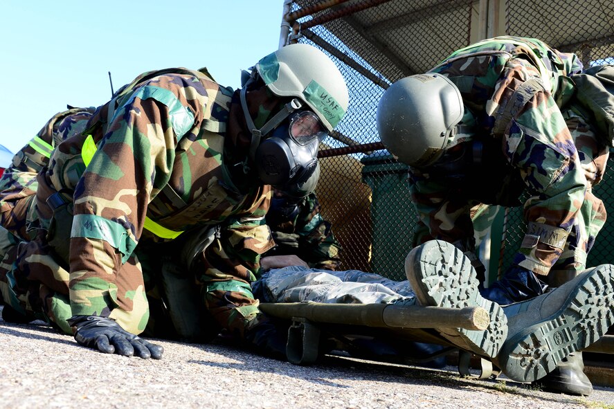 Airmen from the 8th Logistics Readiness Squadron place a casualty on a stretcher after a missile fire exercise as part of Beverly Pack 16-1 at Kunsan Air Base, Republic of Korea, Oct. 6, 2015. The exercise tested par team Airmen on their response time and effectiveness if a real world self-aid and buddy care crisis arose.(U.S. Air Force photo by Senior Airman Ashley L. Gardner/Released)



