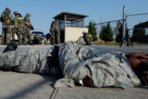 An Airman waits to be taken to the hospital after being treated as a result from a missile fire exercise as part of Beverly Pack 16-1 at Kunsan Air Base, Republic of Korea, Oct. 6, 2015. The exercise tested the efficiency and response time for Airmen performing self-aid and buddy care. (U.S. Air Force photo by Senior Airman Ashley L. Gardner/Released)



