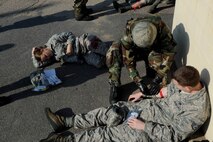 An 8th Logistics Readiness Squadron Airman administers self-aid buddy care as a result from a missile fire exercise as part of Beverly Pack 16-1 at Kunsan Air Base, Republic of Korea, Oct. 6, 2015. The exercise tested par team Airmen on their response time and effectiveness if a real world self-aid and buddy care crisis arose.(U.S. Air Force photo by Senior Airman Ashley L. Gardner/Released)



