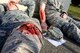 Airmen lay wounded from a missile fire mass casualty exercise as part of Beverly Pack 16-1 at Kunsan Air Base, Republic of Korea, Oct. 6, 2015. The exercise tested par team Airmen on their response time and effectiveness if a real world self-aid and buddy care crisis arose. (U.S. Air Force photo by Senior Airman Ashley L. Gardner/Released)