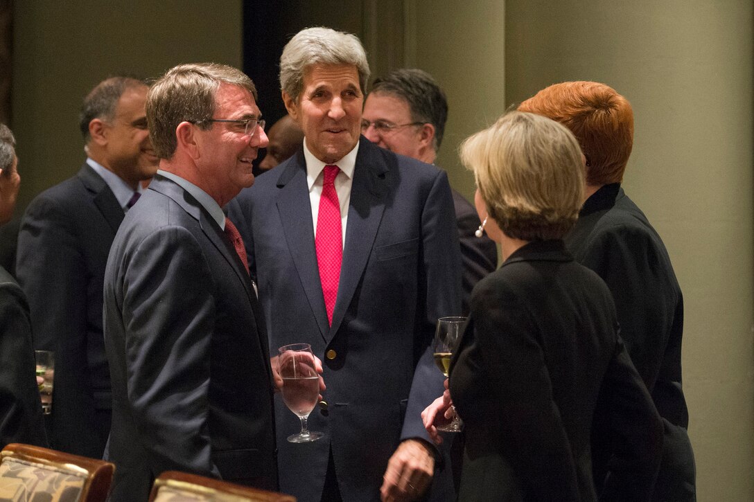 U.S. Defense Secretary Ash Carter and U.S. Secretary of State John Kerry speak with guest during an Australia–United States Ministerial Consultations reception and dinner in Boston, Oct. 12, 2015. DoD photo by Air Force Senior Master Sgt. Adrian Cadiz