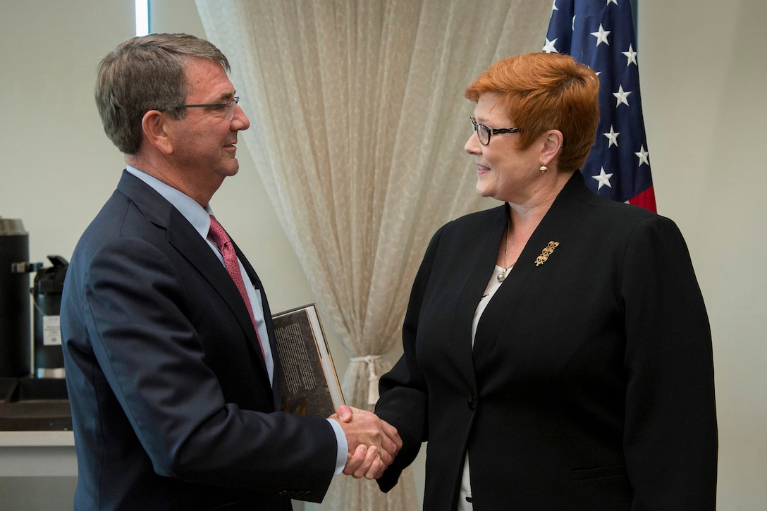 U.S. Defense Secretary Ash Carter shakes hands with Australian Defense Minister Marise Payne during the Australia–United States Ministerial Consultations in Boston, Oct. 12, 2015. The two leaders discussed matters of mutual importance. DoD photo by Air Force Senior Master Sgt. Adrian Cadiz