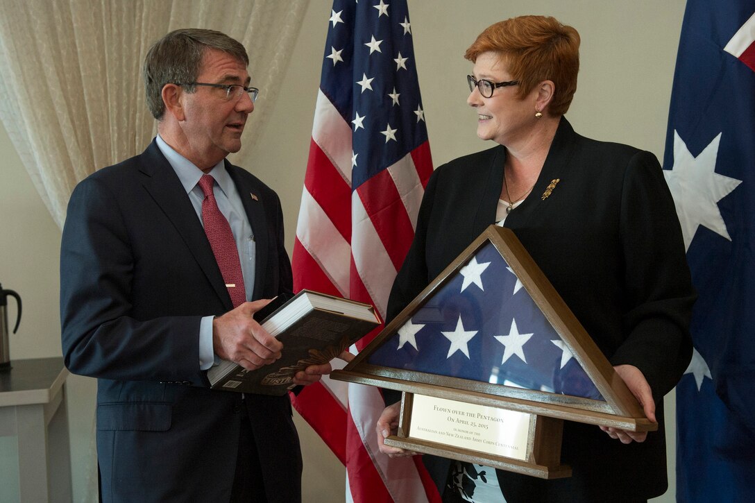 U.S. Defense Secretary Ash Carter and Australian Defense Minister Marise Payne exchange gifts during the Australia–United States Ministerial Consultations in Boston, Oct. 12, 2015. The two leaders discussed defense matters of mutual importance. DoD photo by Air Force Senior Master Sgt. Adrian Cadiz