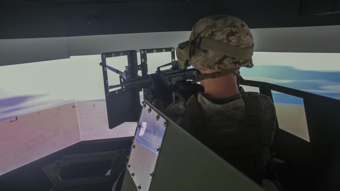 Cpl. Mason Archer, a motor transport operator with Transportation Support Co., Combat Logistics Battalion 2, fires simulated rounds at a fictional enemy during simulated High Mobility Multipurpose Wheeled Vehicle convoy training at Camp Lejeune, N.C., Oct. 7, 2015. Approximately 25 Marines with the unit are undergoing Convoy Leader’s Course in preparation for an Integrated Training Exercise in Twentynine Palms, Calif., later this month. 