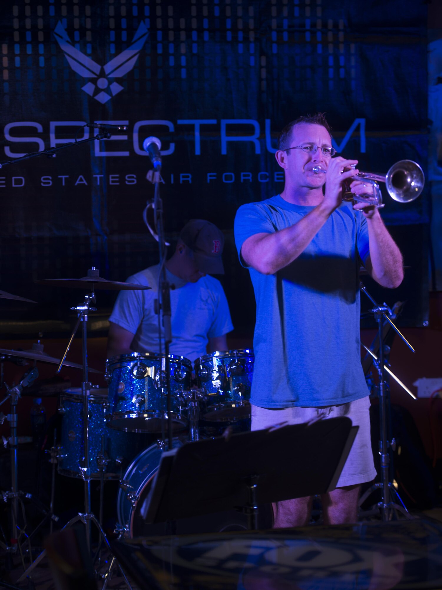 Senior Airman Mark Oates, a trumpet player with the U.S. Air Force’s Central Command Band, Full Spectrum, performs at the Fox Sports Lounge at Al Udeid Air Base, Qatar Oct. 13, 2015. The performance was the band’s last before the group kicks-off a 16-day tour. Oates has been playing the trumpet for 28 years and said he enjoys performing live. (U.S. Air Force Photo/Tech. Sgt. James Hodgman)