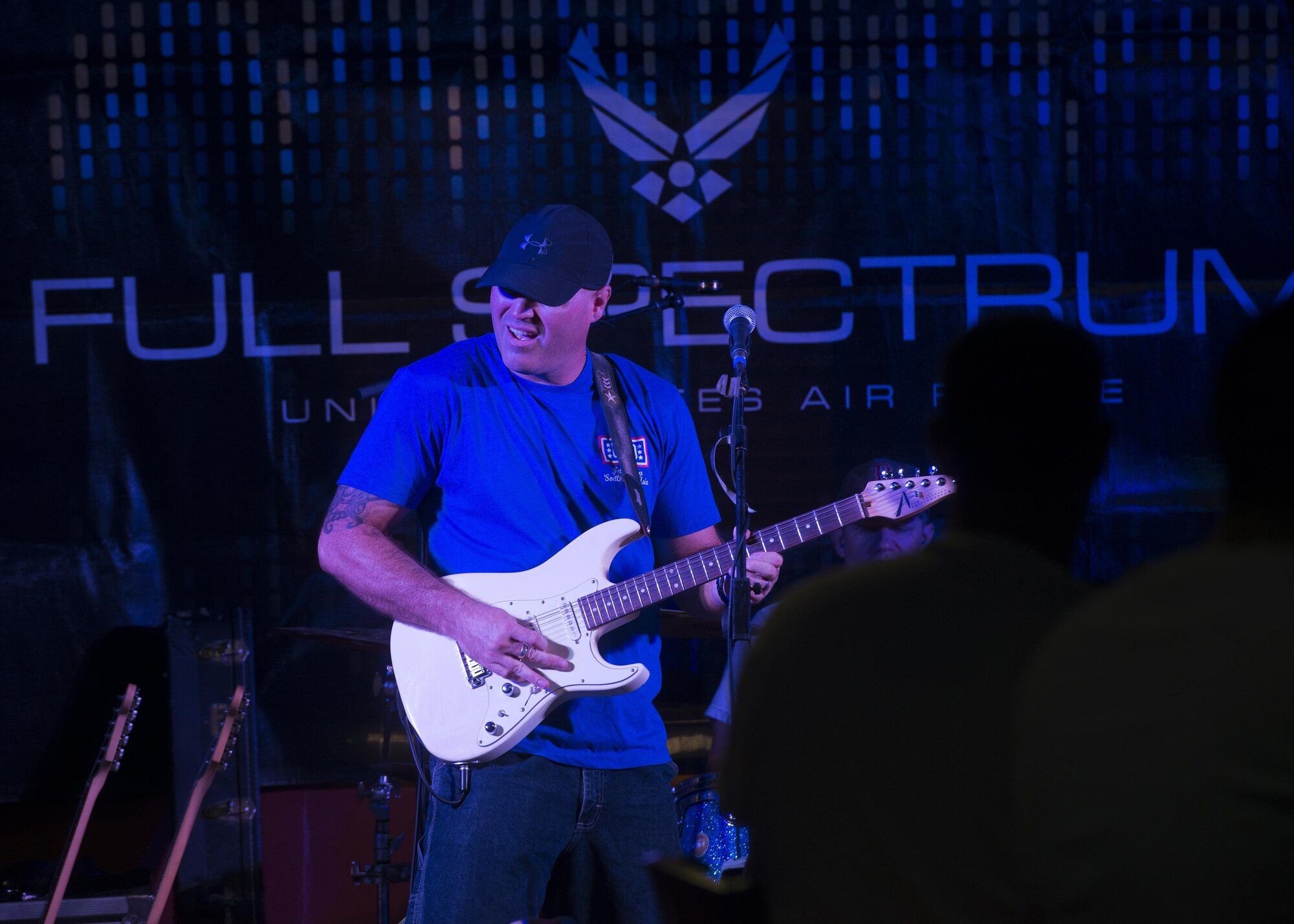 Tech. Sgt. Jason Cale, a guitarist with Air Force’s Central Command Band, Full Spectrum, performs at the Fox Sports Lounge at Al Udeid Air Base, Qatar Oct. 13, 2015. The show which featured hit songs  “Uptown Funk,” “Beat It,” and “Superstitious” was the last for the band before the  group kicks off a 16-day tour.  (U.S. Air Force Photo/Tech. Sgt. James Hodgman)