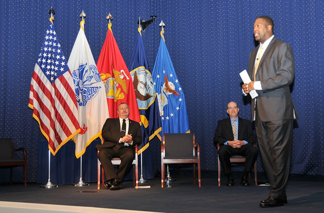 Kenyata Wesley, right, acting director of the Defense Department office of small business programs, speaks to Defense Logistics Agency acquisition professionals at the McNamara Headquarters Complex July 23 during the DLA small business and acquisition broadcast. 