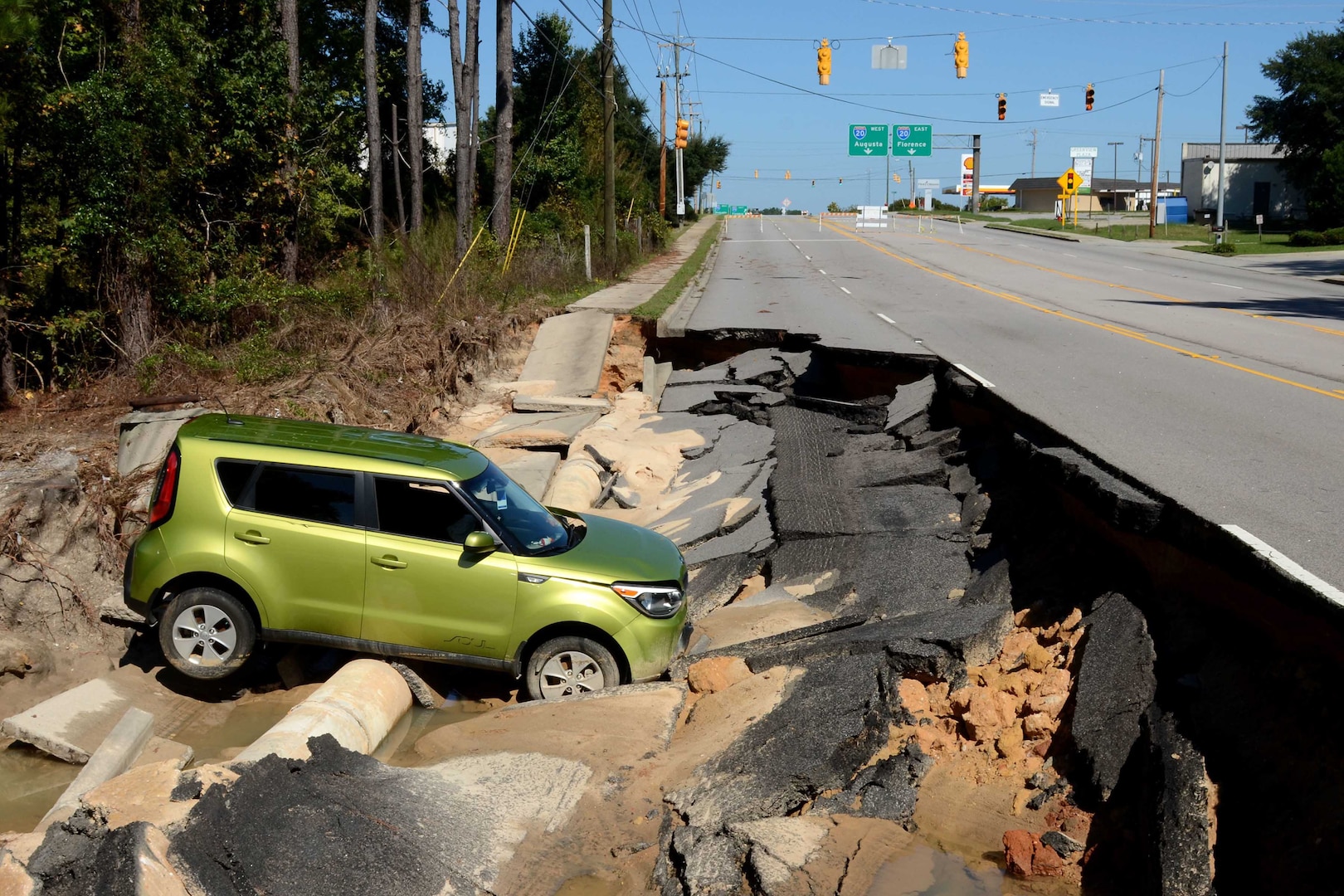 Photo of a vehicle that has fallen from a road during the statewide floods in Columbia, S.C., Oct. 11, 2015. The South Carolina National Guard has been activated to support state and county emergency management agencies and local first responders as historic flooding impacts counties statewide.  There are 2,541 National Guard assets on the ground, which includes engineer support from neighboring North Carolina, and more than 40 State Guard members supporting state flood response efforts.