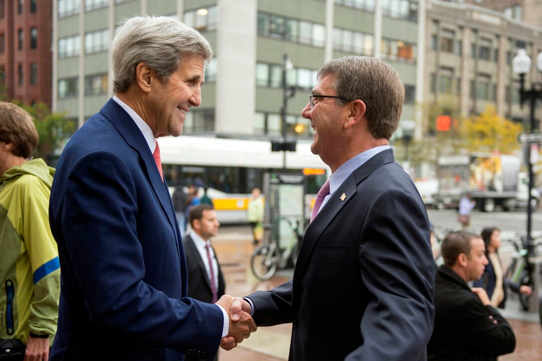 U.S. Defense Secretary Ash Carter, right, exchanges greetings with Secretary of State John Kerry as they arrive at the Boston Public Library during the Australia-U.S. Ministerial Consultations in Boston, Oct. 13, 2015. DoD photo by Air Force Senior Master Sgt. Adrian Cadiz