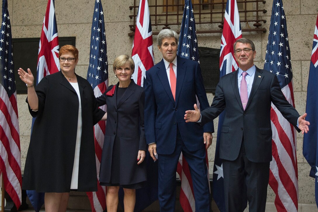 From left, Australian Defense Minister Marise Payne, Australian Foreign Affairs Minister Julie Bishop, U.S. Secretary of State John Kerry and U.S. Defense Secretary Ash Carter wave hello to the media as they pose for a photo at the Boston Public Library during the Australia-U.S. Ministerial Consultations in Boston, Oct. 13, 2015. DoD photo by Air Force Senior Master Sgt. Adrian Cadiz