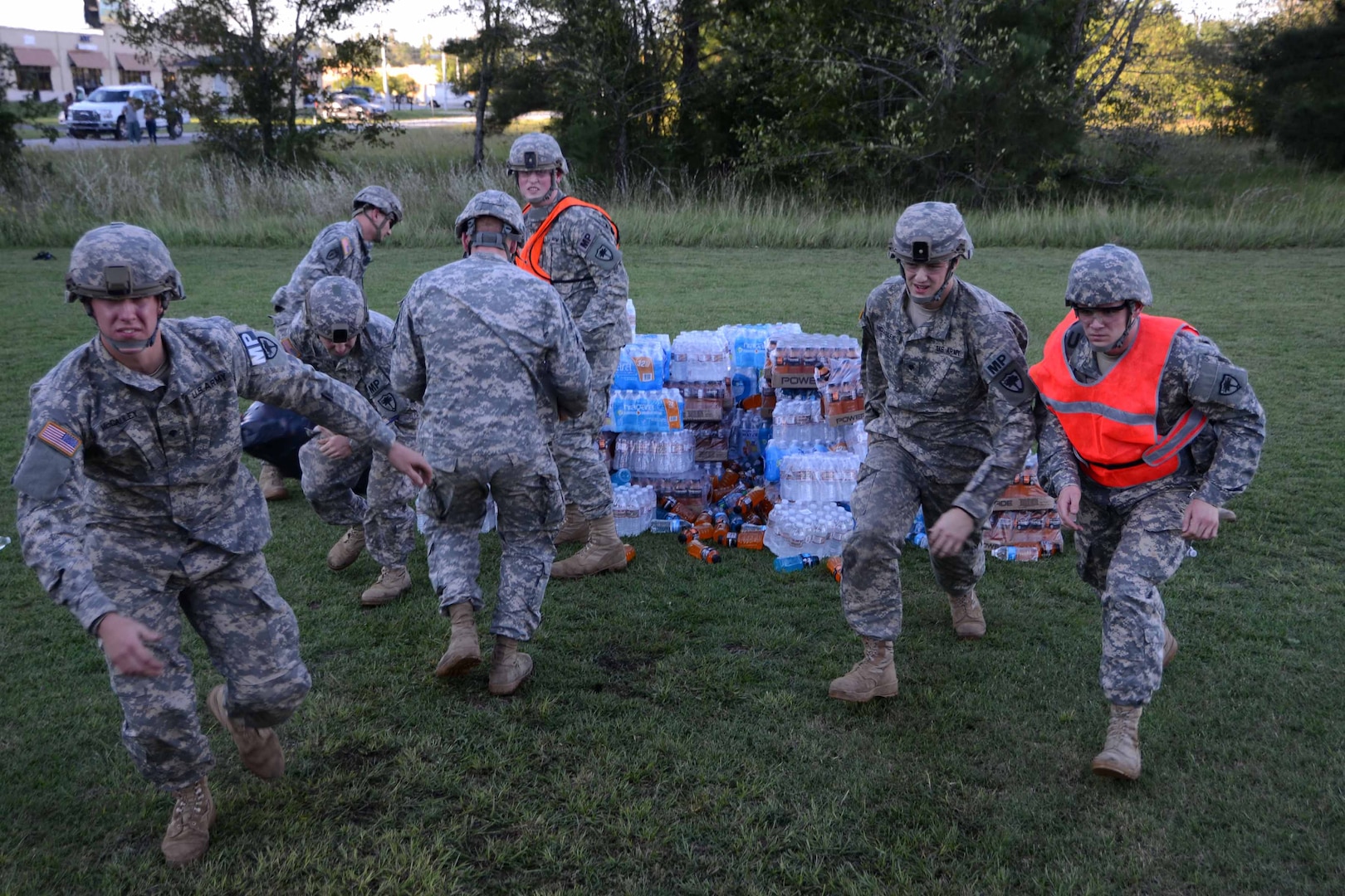 Soldiers from the South Carolina Army National Guard move supplies from a Boeing CH-47 Chinook helicopter in Kingstree, South Carolina during a statewide flood response, Oct. 6. DLA Troop Support's Subsistence supply chain will provide Fort Jackson with water and food at least through the weekend.