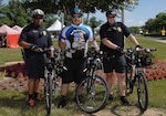 DLA Police Sgt. James Sprecher, center, and other members of the DLA Police bike team display the trophy Sprecher received for participating in the 250-mile Law Enforcement United Road to Hope, pose during the McNamara Headquarters Complex Family Day June 24. 