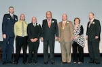 DLA Director Air Force Lt. Gen. Andy Busch poses for a photo with inductees of the 2015 DLA Hall of Fame. They are: Matt and Randy Byus, brother and father of Stephen Byus; Richard Connelly; retired Army Lt. Gen. Robert Dail; Mae DeVincentis; and Ivan Hall. 