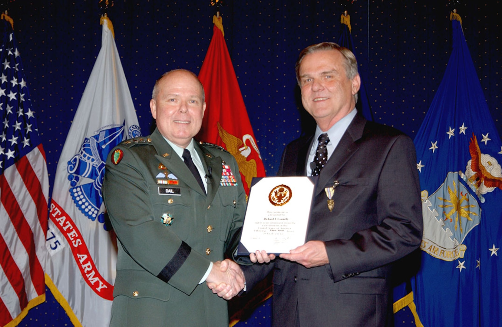 DLA Hall of Fame inductee Richard Connelly, right, at his retirement ceremony in 2007 with then-DLA Director Army Lt. Gen. Robert Dail, who is also a 2014 inductee. 