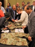 Vendors and supply chain reps from Clothing and Textiles discuss the Army's new Operational Camouflage Pattern uniform during the Joint Advanced Planning Brief for Industry June 16 in Cherry Hill, New Jersey. The two-day event included more than 260 vendors, 40 customers and a Captains of Industry meeting with DLA Director Air Force Lt. Gen. Andy Bush.