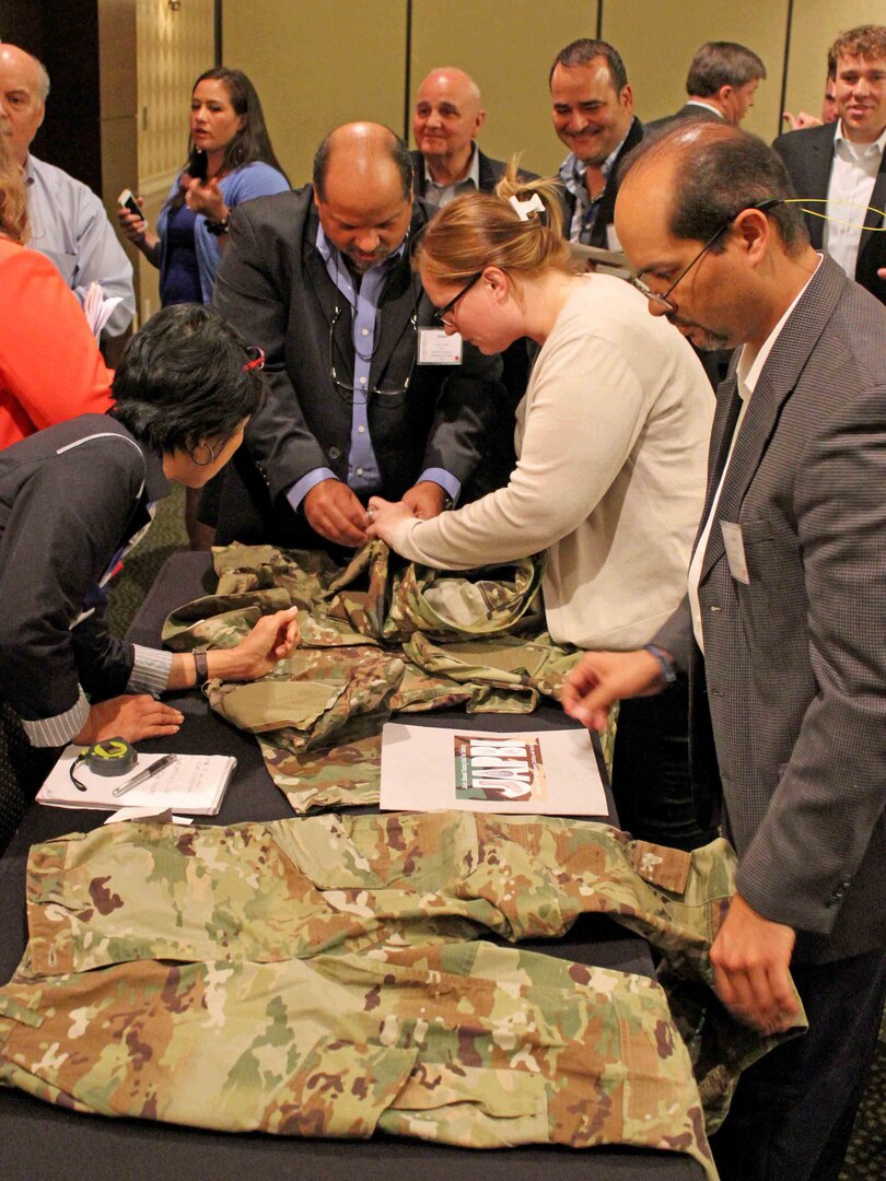 Vendors and supply chain reps from Clothing and Textiles discuss the Army's new Operational Camouflage Pattern uniform during the Joint Advanced Planning Brief for Industry June 16 in Cherry Hill, New Jersey. The two-day event included more than 260 vendors, 40 customers and a Captains of Industry meeting with DLA Director Air Force Lt. Gen. Andy Bush.