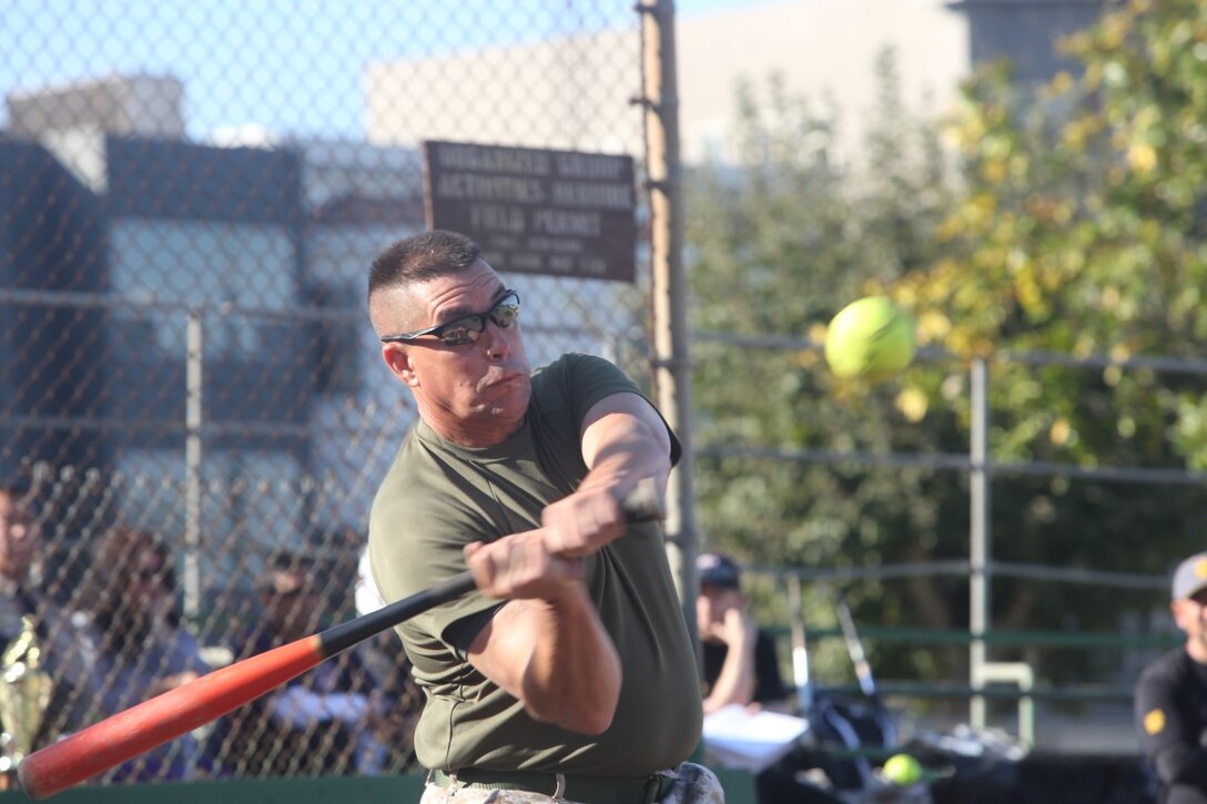 Master Gunnery Sgt. Michael Parker, with Task Force San Francisco, hits a ball while at bat during a softball tournament at Moscone Field as part of San Francisco Fleet Week 2015, Oct. 8. SFFW ’15 is a week-long event that blends a unique training and education program, bringing together key civilian emergency responders and Naval crisis-response forces to exchange best practices focused on humanitarian assistance disaster relief with particular emphasis on defense support to civil authorities. (Pfc. Devan K. Gowans)