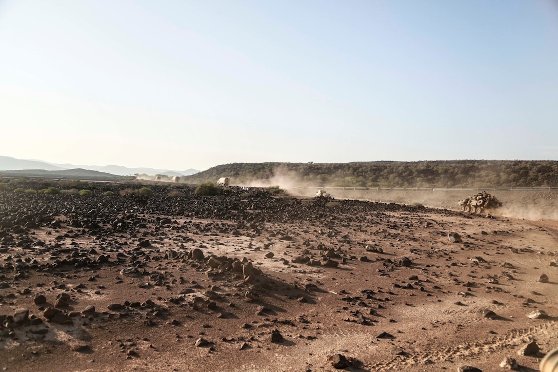 ARTA TRAINING RANGE, Djibouti (Oct. 4, 2015) U.S. Marines with the 15th Marine Expeditionary Unit move to an objective during a desert survival and tactics course. Elements of the 15th MEU trained with the 5th Overseas Combined Arms Regiment (RIAOM) in Djibouti in order to improve interoperability between the MEU and the French military. (U.S. Marine Corps photo by Sgt. Steve H. Lopez/Released)
