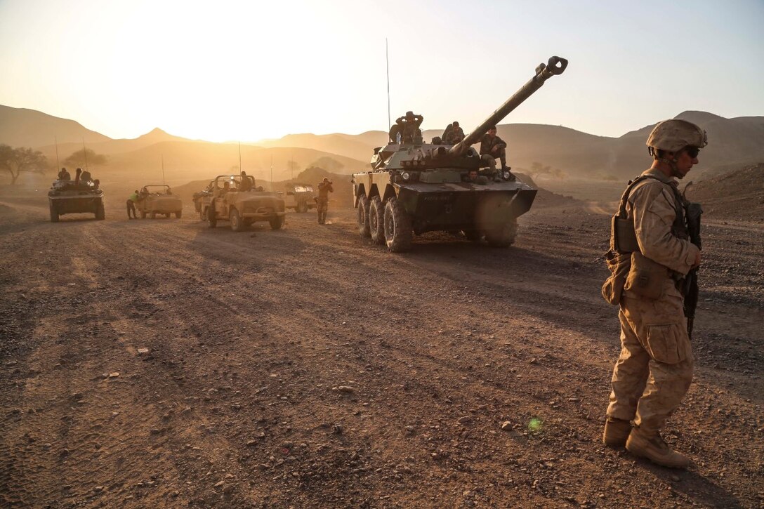ARTA TRAINING RANGE, Djibouti (Oct. 6, 2015) A U.S. Marine with the 15th Marine Expeditionary Unit prepares to step off for a patrol during a desert survival and tactics course. Elements of the 15th MEU trained with the 5th Overseas Combined Arms Regiment (RIAOM) in Djibouti from Sept. 21 to Oct. 7 in order to improve interoperability between the MEU and the French military. (U.S. Marine Corps photo by Sgt. Steve H. Lopez/Released)