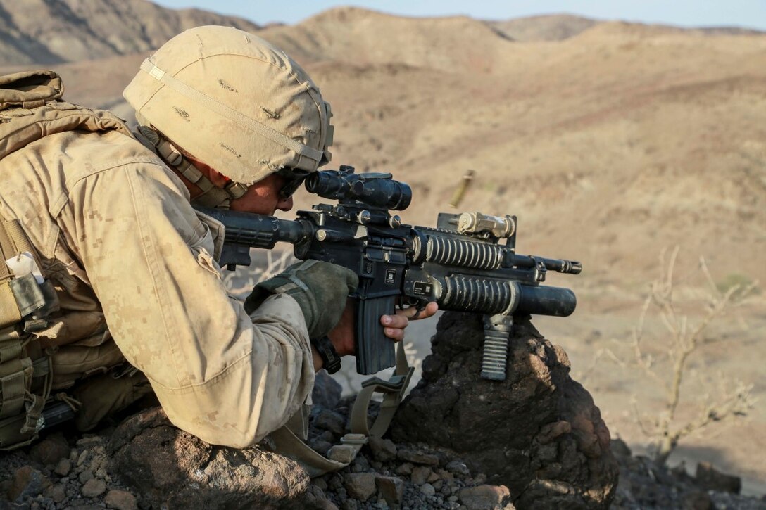 ARTA TRAINING RANGE, Djibouti (Oct. 6, 2015) U.S. Marine Cpl. Michael Odintz engages targets during a desert survival and tactics course. Odintz is a squad leader with Delta Company, 1st Light Armored Reconnaissance Detachment, 15th Marine Expeditionary Unit. Elements of the 15th MEU trained with the 5th Overseas Combined Arms Regiment (RIAOM) in Djibouti from Sept. 21 to Oct. 7 in order to improve interoperability between the MEU and the French military. (U.S. Marine Corps photo by Sgt. Steve H. Lopez/Released)