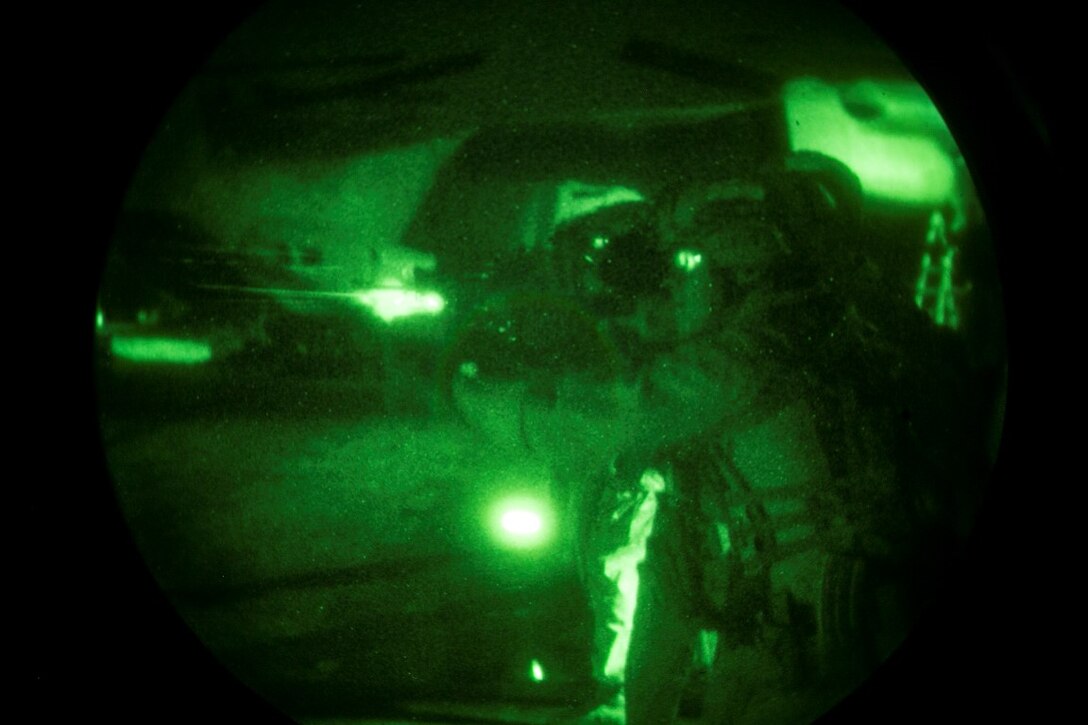 ARABIAN GULF (Oct. 11, 2015) U.S. Marines with the 15th Marine Expeditionary Unit’s Maritime Raid Force fire at their targets during a deck shoot aboard the amphibious assault ship USS Essex (LHD 2). These Marines practiced shooting at night to enhance their speed and accuracy while shooting in low-light conditions. The 15th MEU, embarked aboard the ships of the Essex ARG, is deployed to maintain regional security in the U.S. 5th Fleet area of operations. (U.S. Marine Corps photo by Cpl. Anna Albrecht/Released)