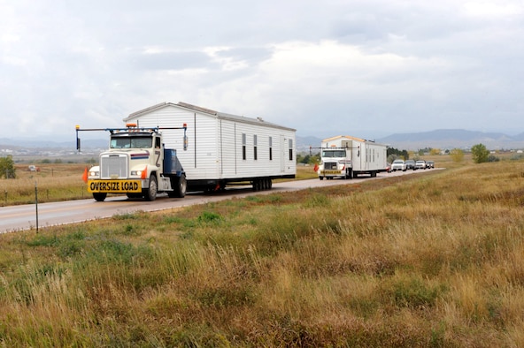 The first two manufactured housing units, part of the Federal Emergency Management Agency's response and recovery efforts related to severe storms and flooding on the Pine Ridge Indian Reservation, arrived at Ellsworth Air Force Base, S.D., Oct. 8, 2015, after traveling from housing storage facilities in Selma, Ala., and Cumberland, Md. The base will serve as the staging area for the FEMA operation, providing space to store the units that will be used to house residents with damaged homes. (U.S. Air Force photo/Airman 1st Class Denise Nevins)