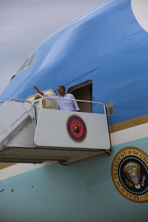 President Barack Obama waves as he boards Air Force One, the presidential plane, aboard Marine Corps Air Station Miramar, Calif., Oct. 12. The president greeted 3rd Marine Aircraft Wing and MCAS Miramar Marines and their families on the flight line before returning to Washington.